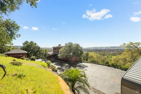 a view of a swimming pool with a table and chairs