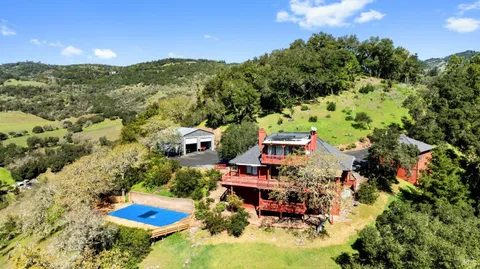 an aerial view of a house with a garden