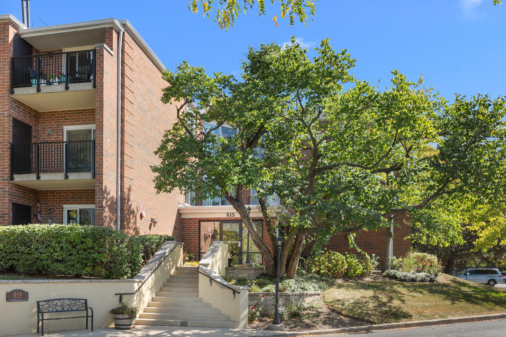 a front view of a house with trees