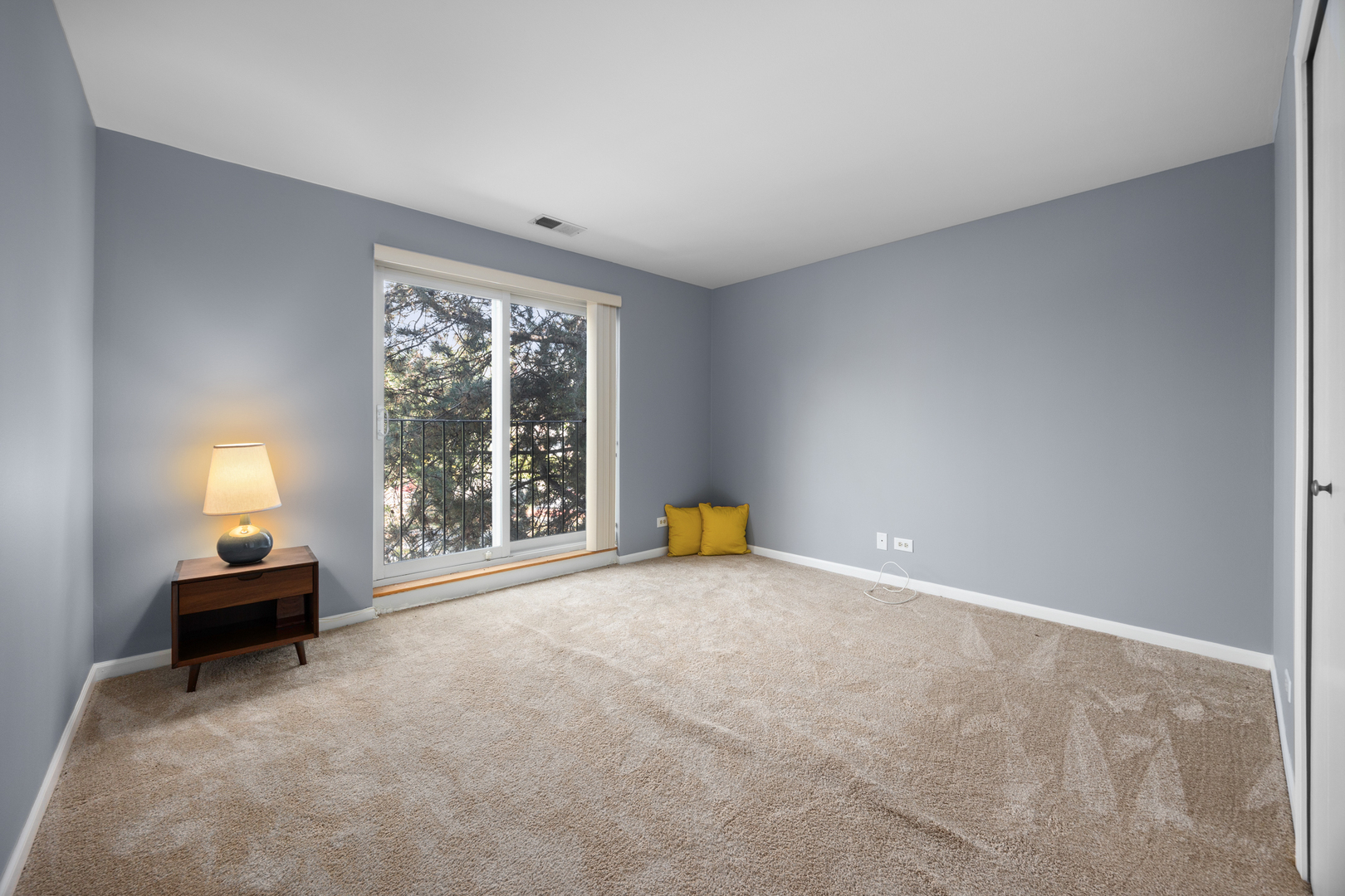 815 Leicester Road, Unit 219 Elk Grove Village, IL 60007 - Photo 17 of 26 a view of empty room with a window