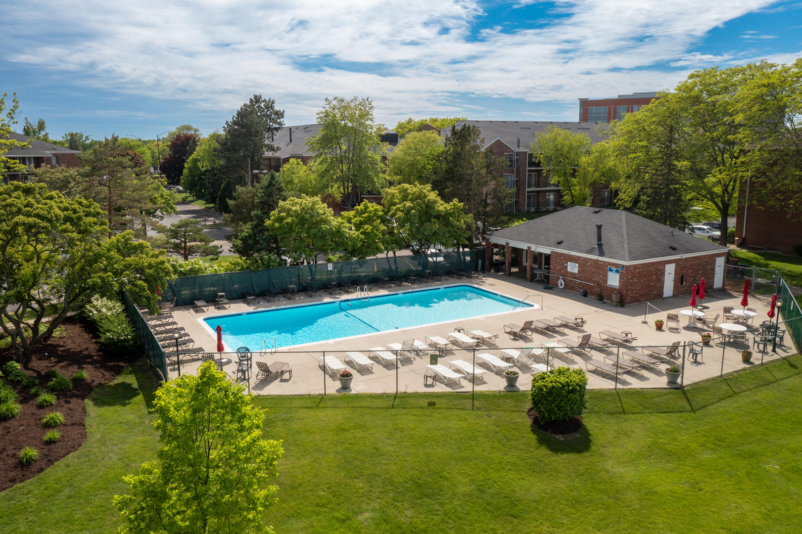 815 Leicester Road, Unit 219 Elk Grove Village, IL 60007 - Photo 22 of 26 a view of a swimming pool with a yard