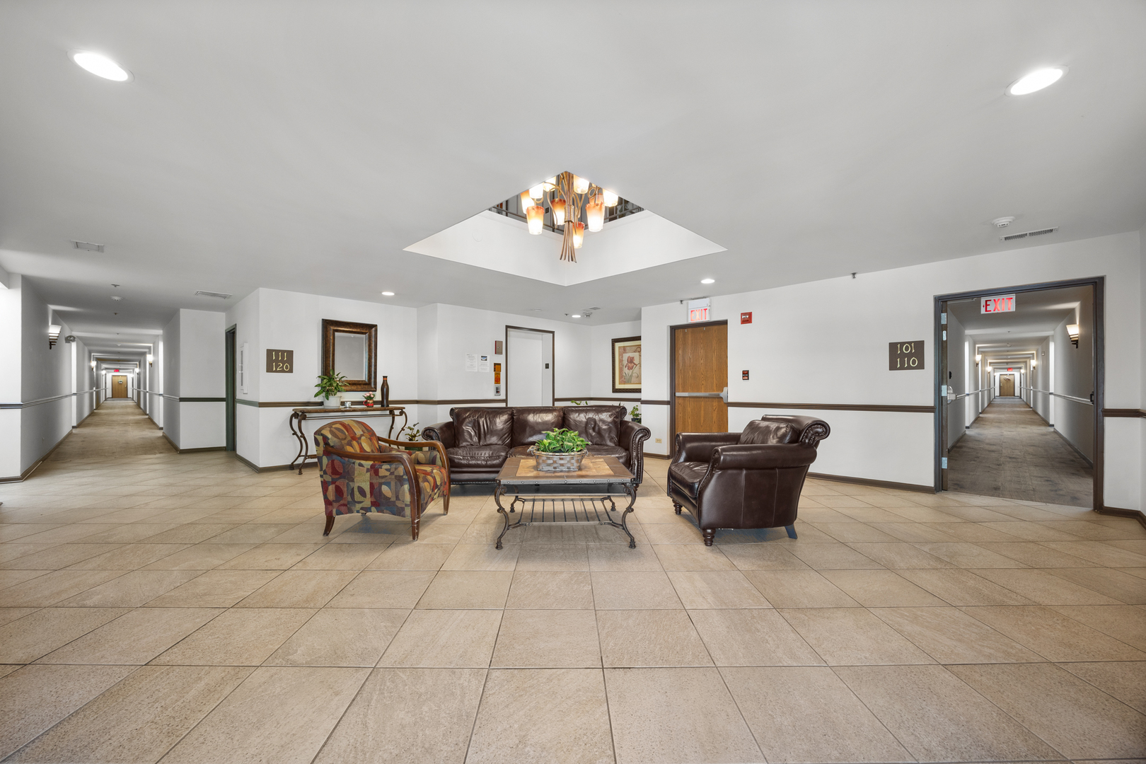 815 Leicester Road, Unit 219 Elk Grove Village, IL 60007 - Photo 24 of 26 a living room with furniture and a table