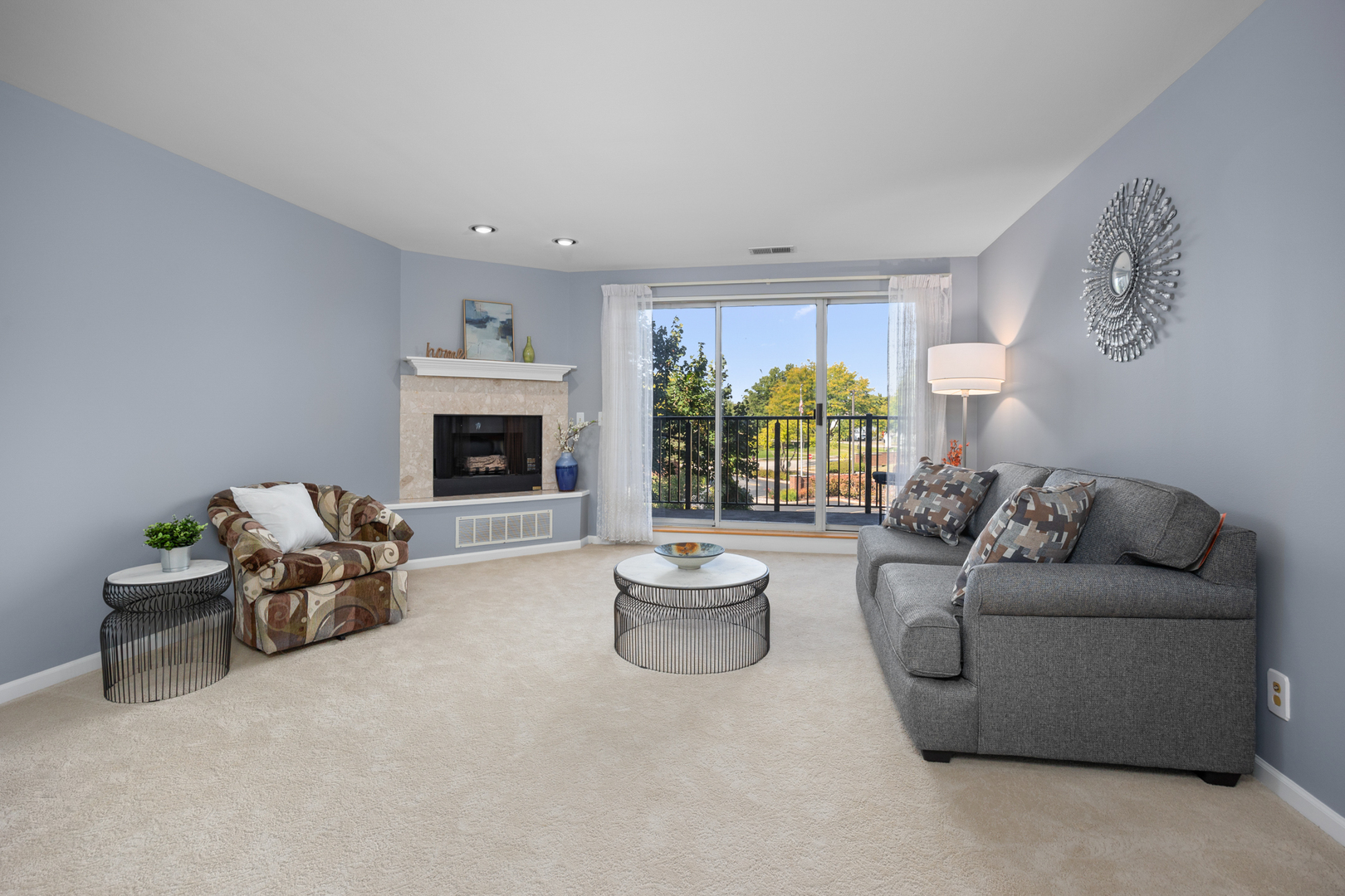 815 Leicester Road, Unit 219 Elk Grove Village, IL 60007 - Photo 5 of 26 a living room with furniture and a fireplace