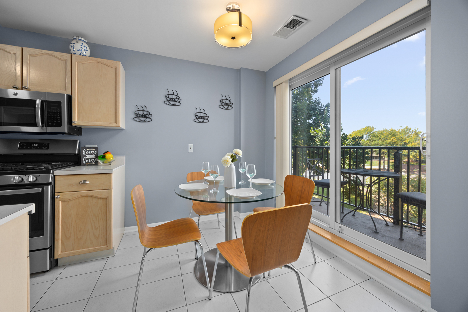 815 Leicester Road, Unit 219 Elk Grove Village, IL 60007 - Photo 9 of 26 a view of a dining room with furniture a chandelier and wooden floor