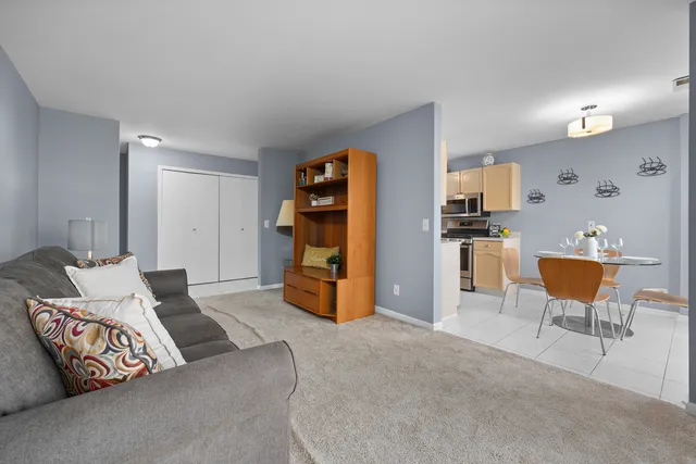 a bedroom with furniture and a book shelf