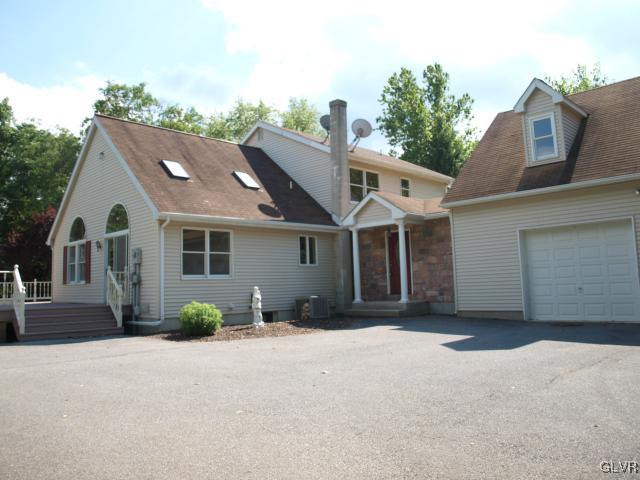 4952 Cedar Grove Road Bangor, PA 18013 - Photo 1 of 50 a front view of a house with a garden