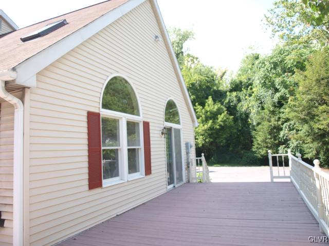 4952 Cedar Grove Road Bangor, PA 18013 - Photo 14 of 50 a view of backyard with large trees and wooden fence