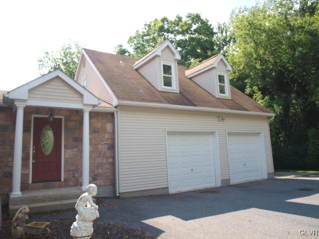 4952 Cedar Grove Road Bangor, PA 18013 - Photo 16 of 50 a front view of a house with a yard and garage