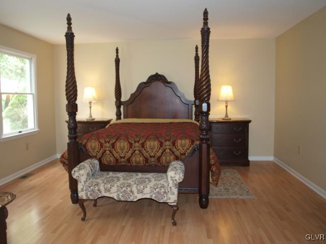 4952 Cedar Grove Road Bangor, PA 18013 - Photo 27 of 50 a bed sitting in a bedroom next to a window