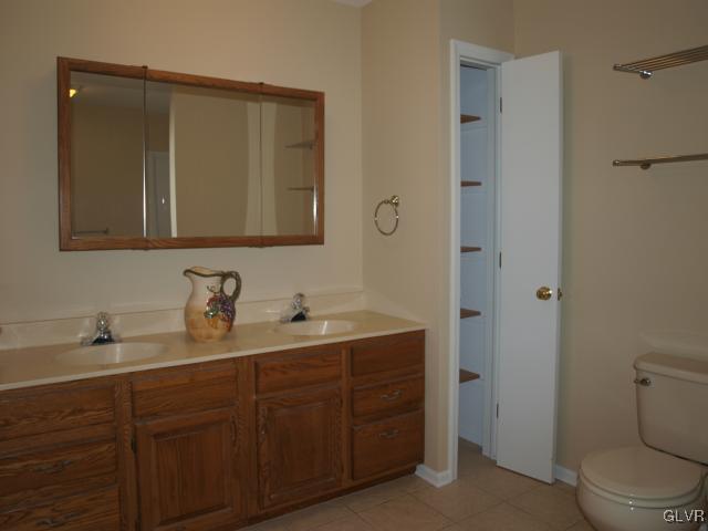 4952 Cedar Grove Road Bangor, PA 18013 - Photo 28 of 50 a bathroom with a toilet sink and mirror