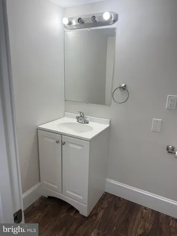 a bathroom with a sink and vanity