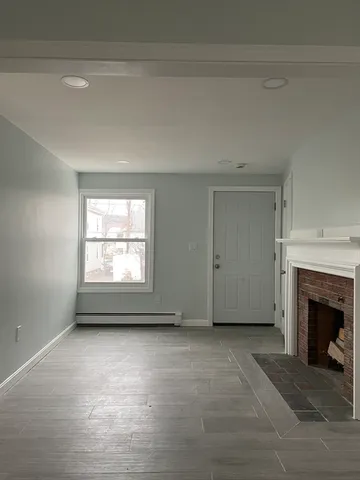 an empty room with a fireplace