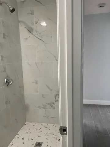 a bathroom with a sink and shower