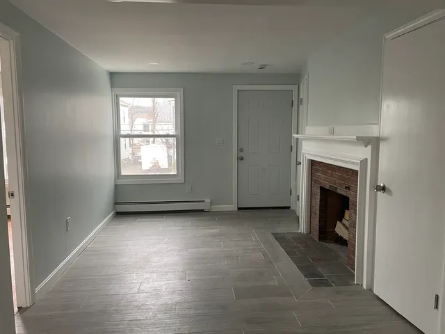 a view of a room with window wooden floor and a ceiling fan