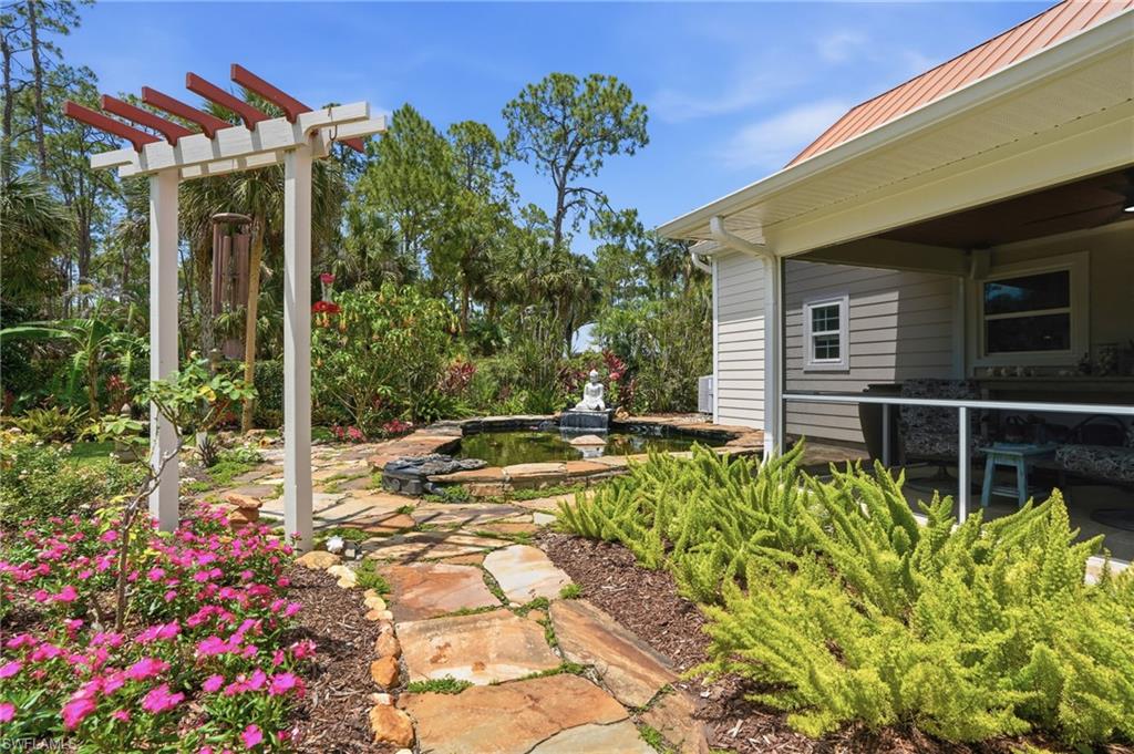 681 7th Street Southwest Naples, FL 34117 - Photo 37 of 50 Walkway to Koi Pond