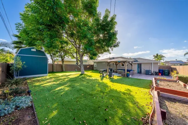 a view of a house with swimming pool and sitting area