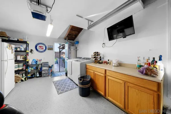 a kitchen with a sink and a stove top oven