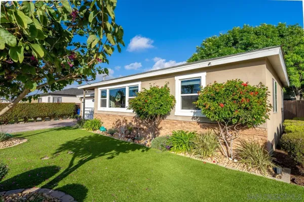 a view of house with backyard