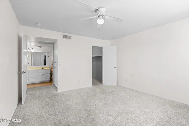 a view of a bedroom with a bathroom