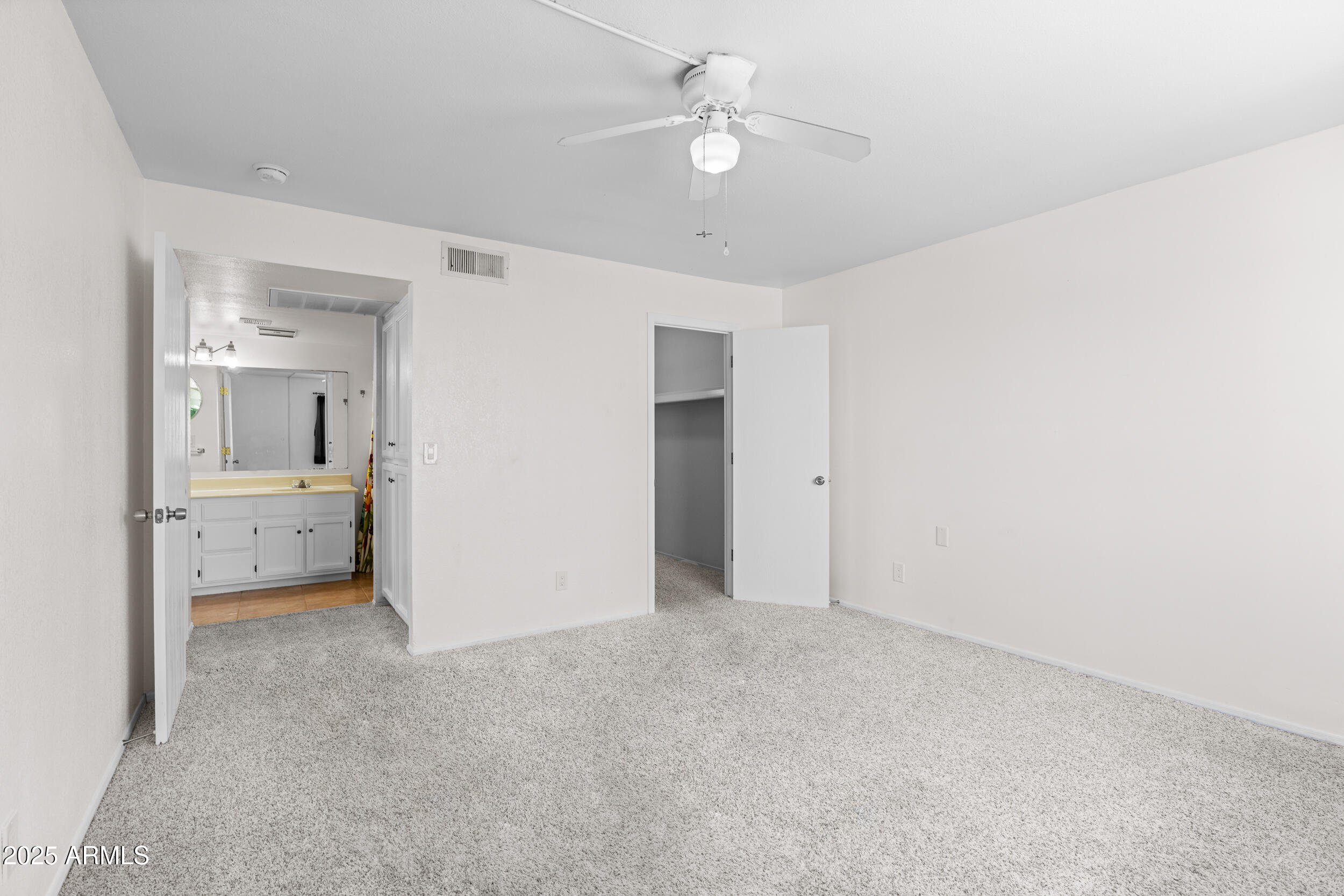 222 West Brown Road, Unit 36 Mesa, AZ 85201 - Photo 11 of 16 a view of a bedroom with a bathroom