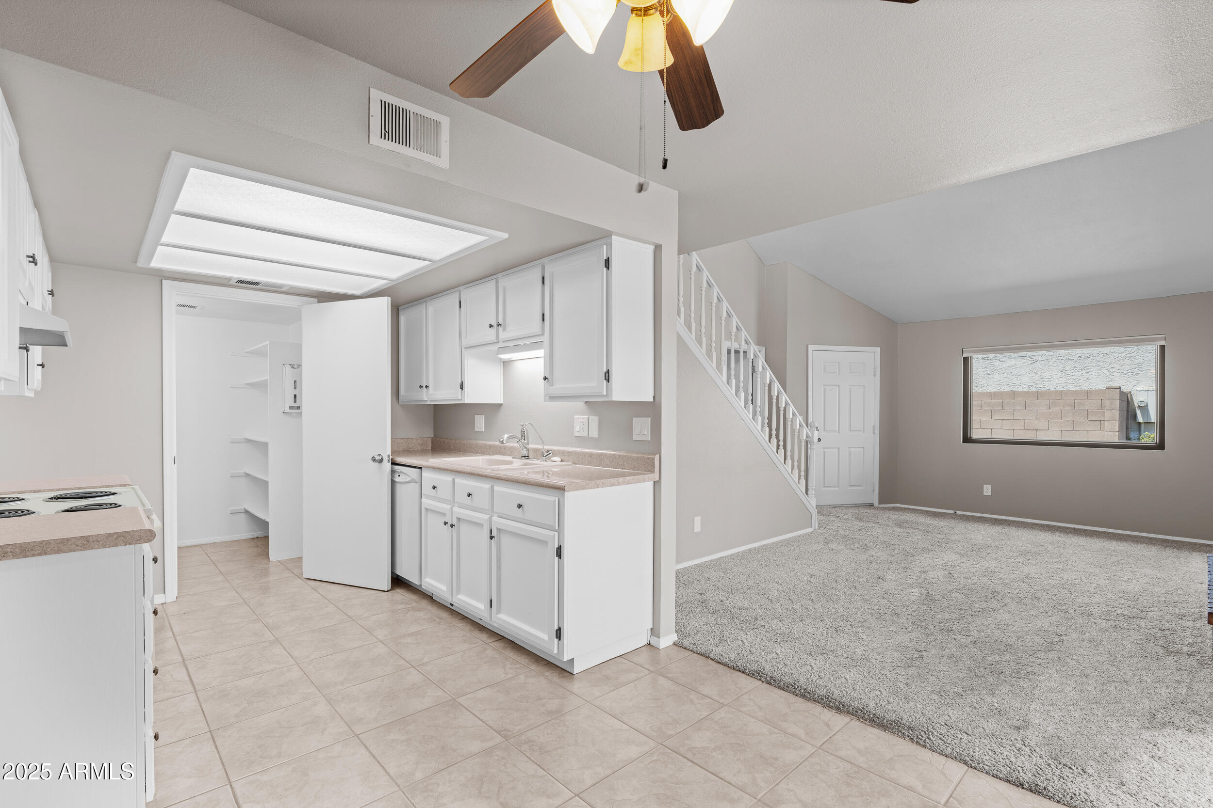 222 West Brown Road, Unit 36 Mesa, AZ 85201 - Photo 5 of 16 a large white kitchen with a stove and a refrigerator