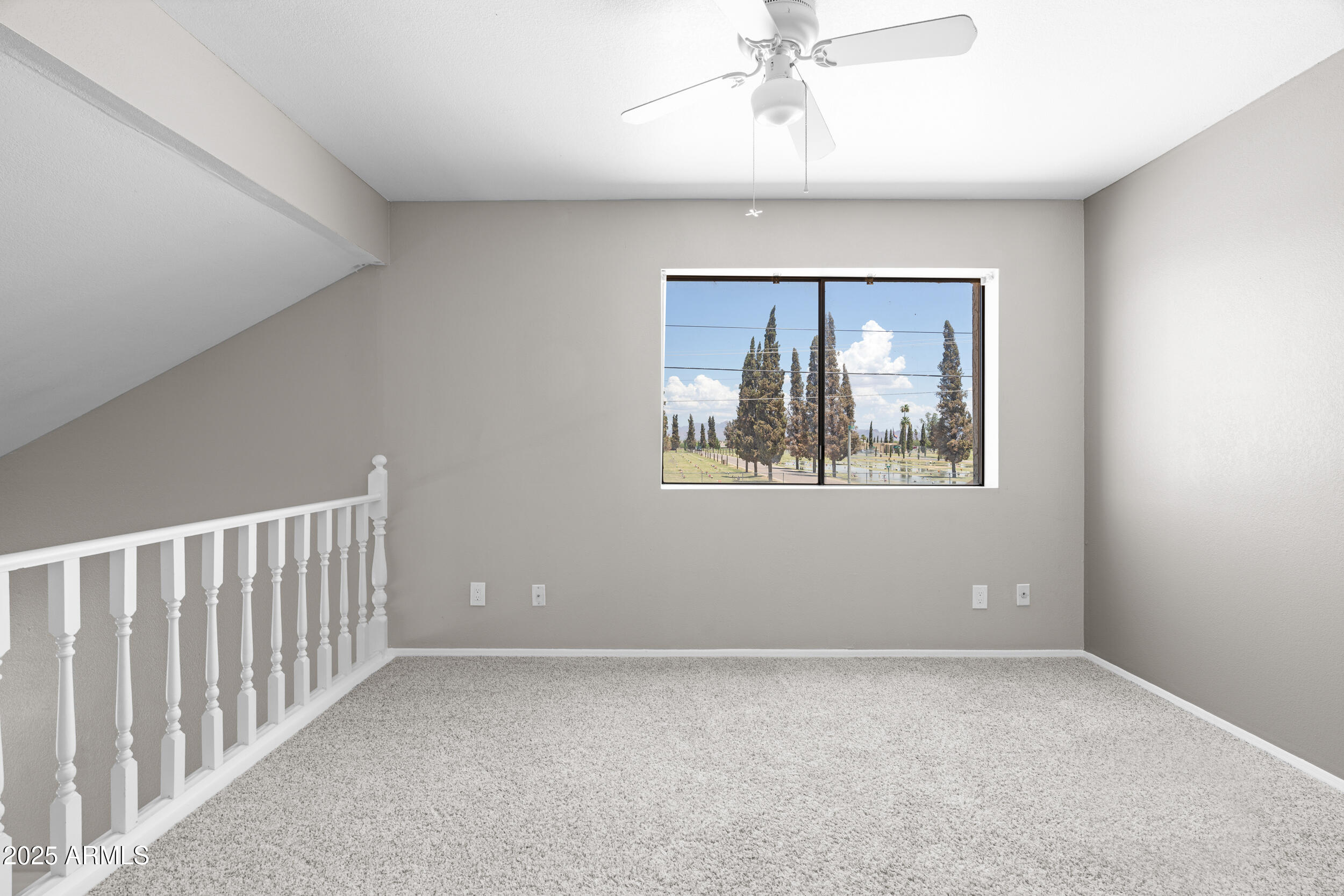 222 West Brown Road, Unit 36 Mesa, AZ 85201 - Photo 9 of 16 a view of an empty room with a window