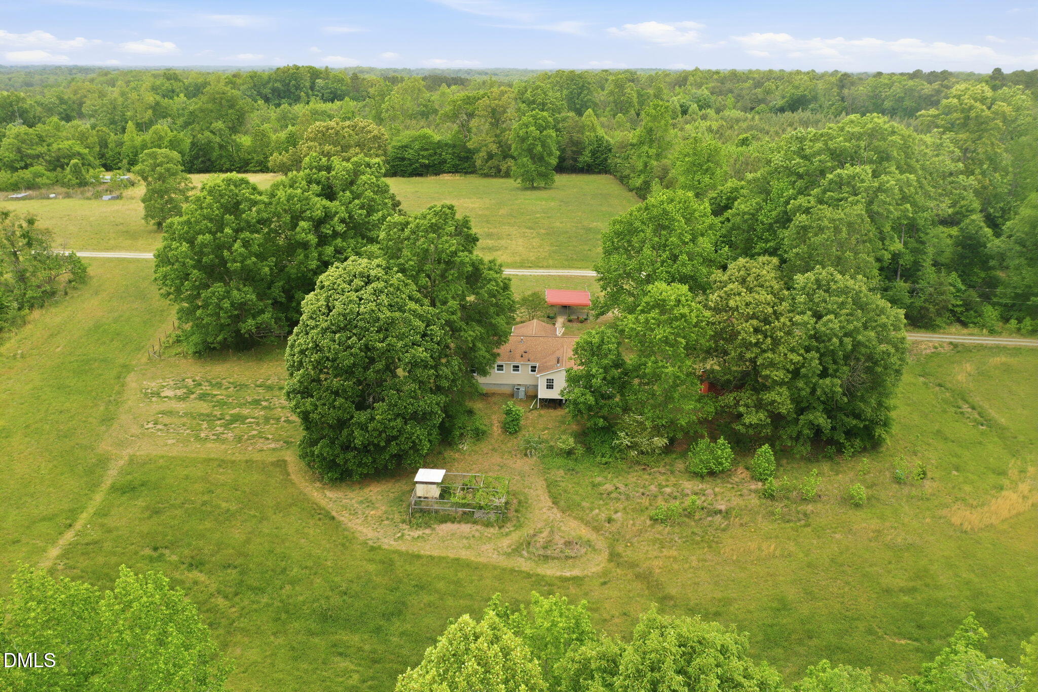 3200 Mill Creek Road Efland, NC 27243 - Photo 5 of 44 a view of a garden with a building in the background