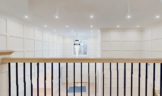 an aerial view of a house with garden space and street view