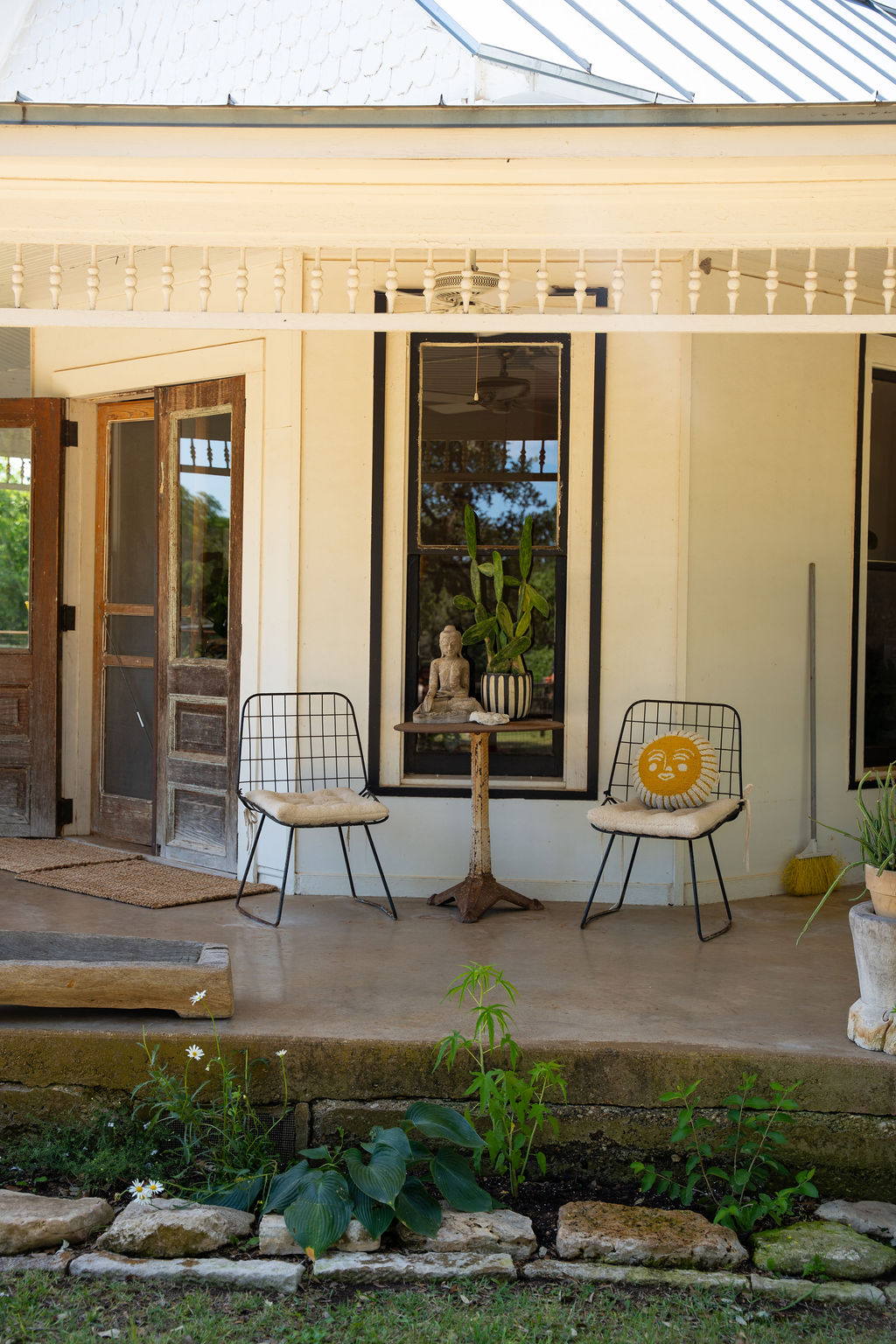 1294 Crabapple Road Blanco, TX 78606 - Photo 4 of 32 A tranquil front porch with decorative balusters invites quiet relaxation.