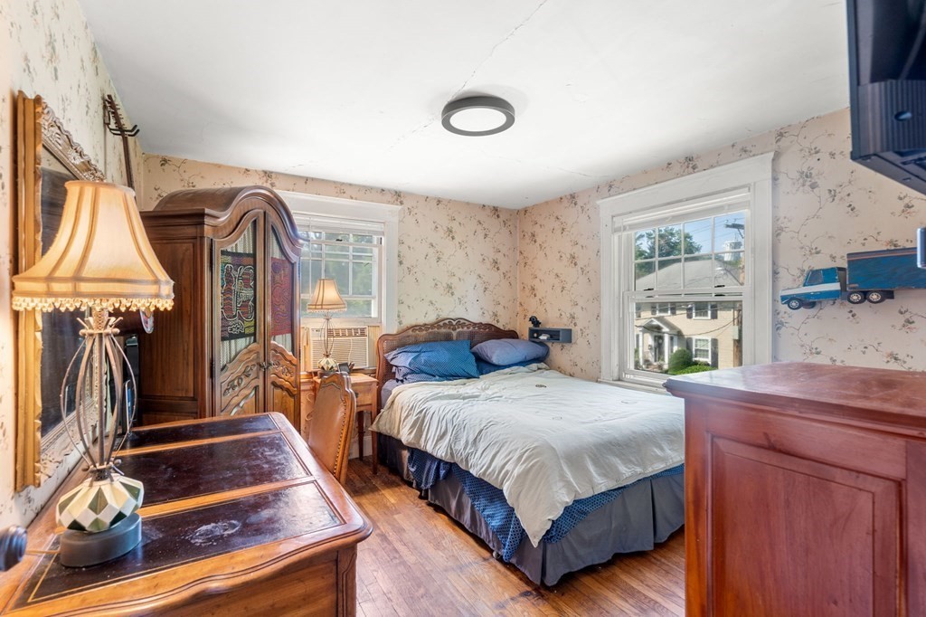 46 Rowe Street Milton, MA 02186 - Photo 17 of 20 a bedroom with a bed and a window