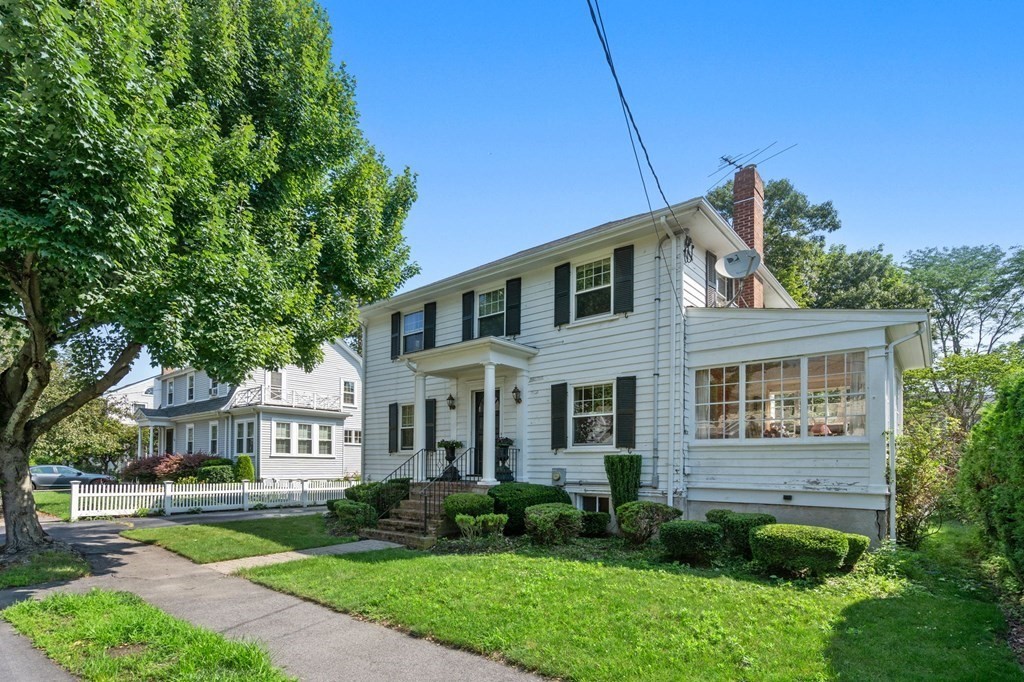 46 Rowe Street Milton, MA 02186 - Photo 2 of 20 a front view of a house with a yard