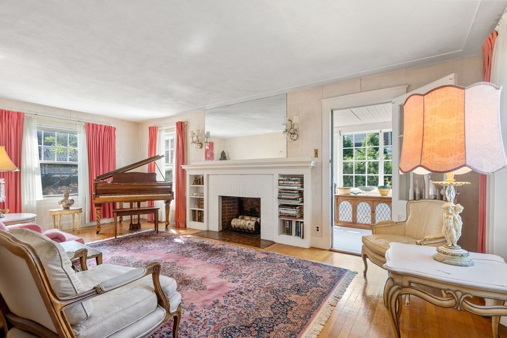46 Rowe Street Milton, MA 02186 - Photo 7 of 20 a living room with furniture fireplace and window