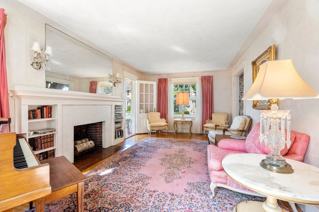46 Rowe Street Milton, MA 02186 - Photo 8 of 20 a living room with furniture window and a fireplace