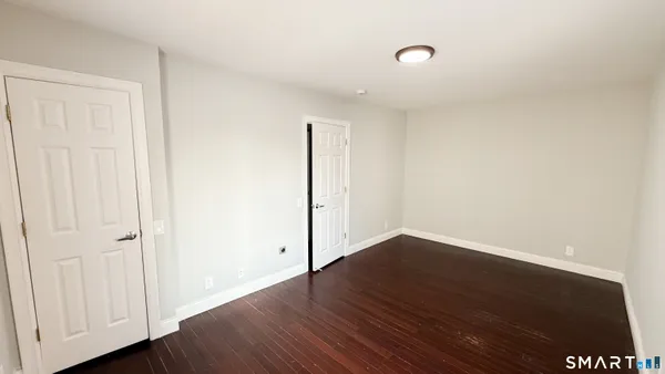 a white toilet sitting next to a bathroom sink