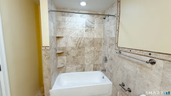 a bathroom with a sink vanity and a mirror