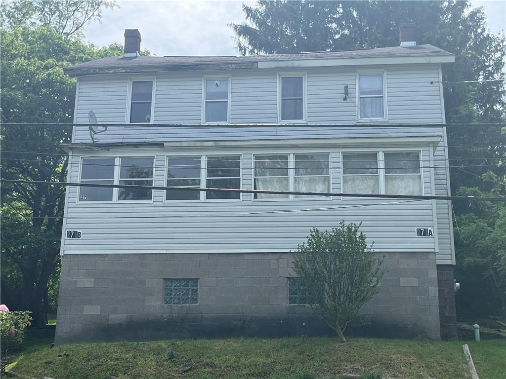 271-a Wendel Road Irwin, PA 15642 - Photo 1 of 19 a front view of a house with garden