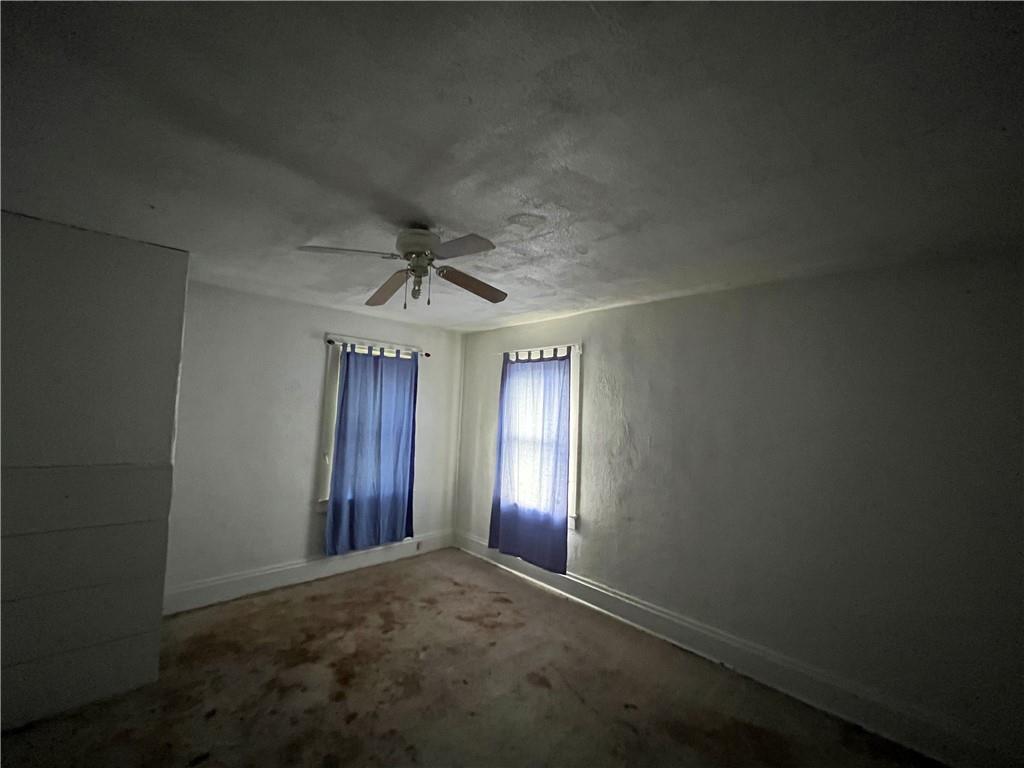 271-a Wendel Road Irwin, PA 15642 - Photo 17 of 19 an empty room with stairs and windows