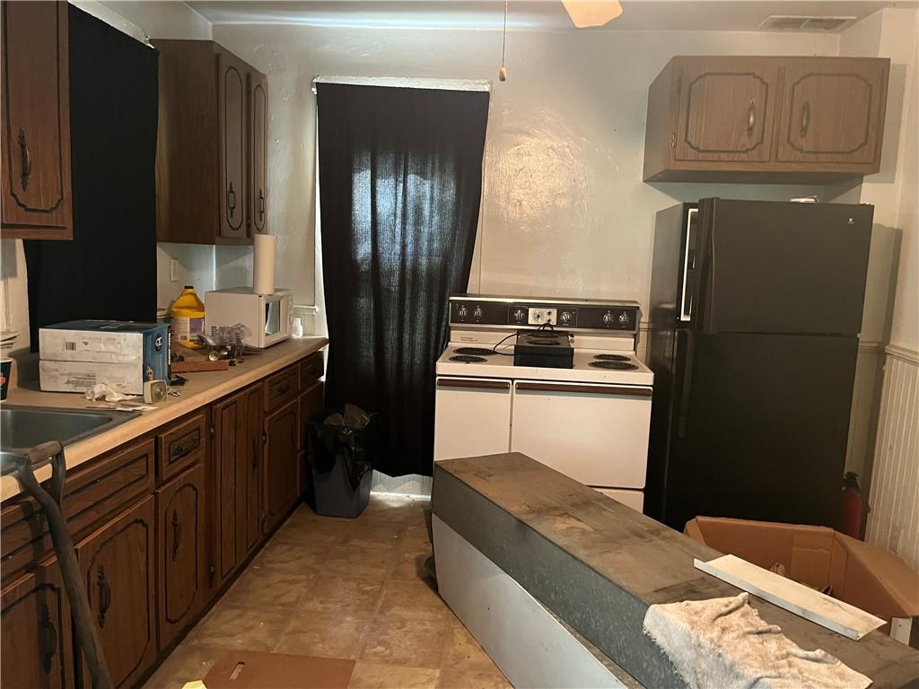 271-a Wendel Road Irwin, PA 15642 - Photo 8 of 19 a kitchen with stainless steel appliances granite countertop a refrigerator a stove and a sink