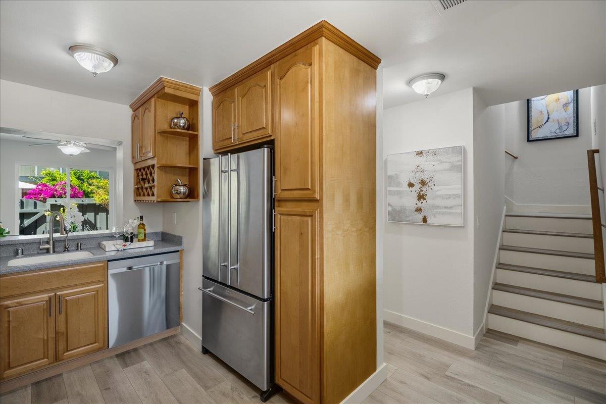 4790 Raspberry Place San Jose, CA 95129 - Photo 12 of 45 a kitchen with stainless steel appliances granite countertop a refrigerator and a sink