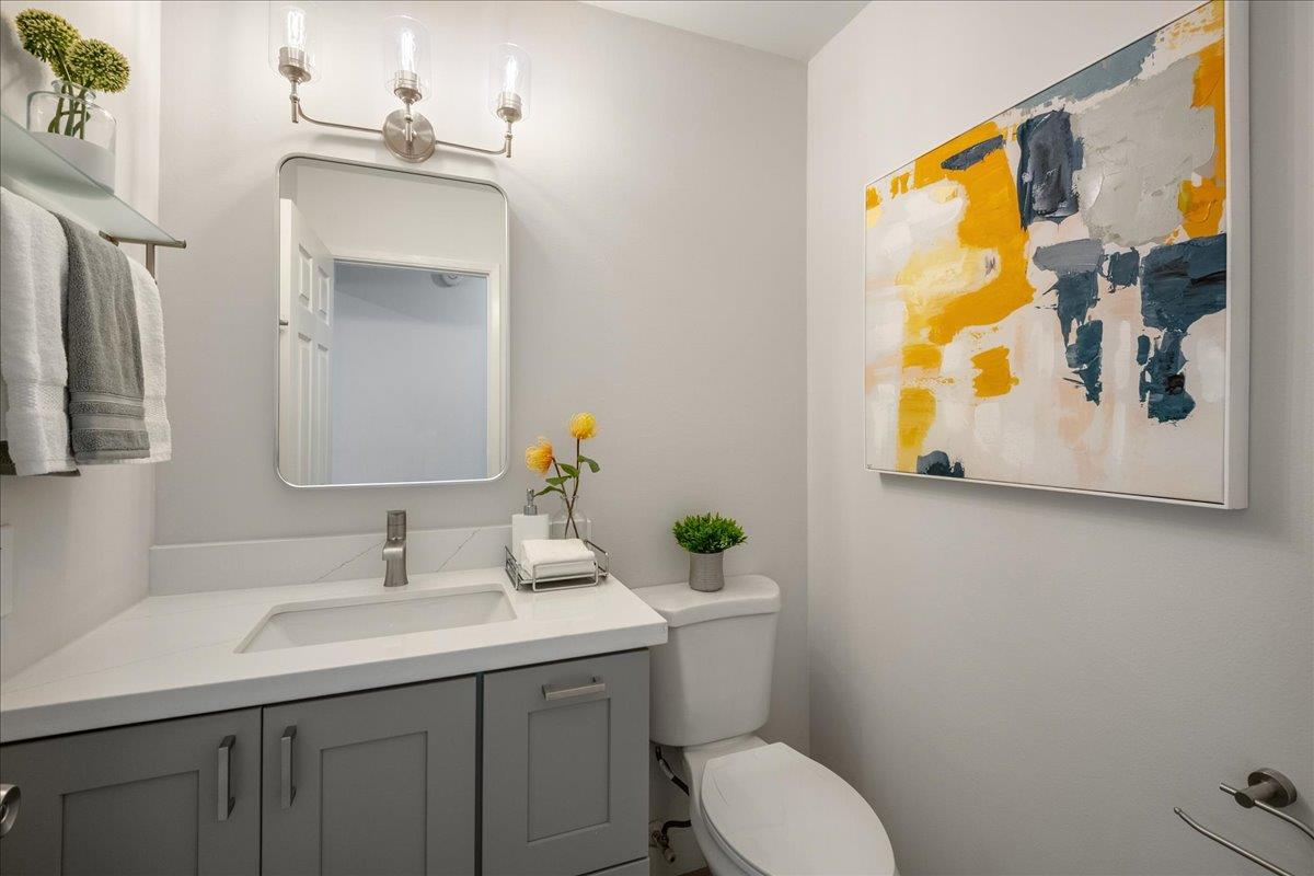 4790 Raspberry Place San Jose, CA 95129 - Photo 13 of 45 a bathroom with a toilet sink and mirror