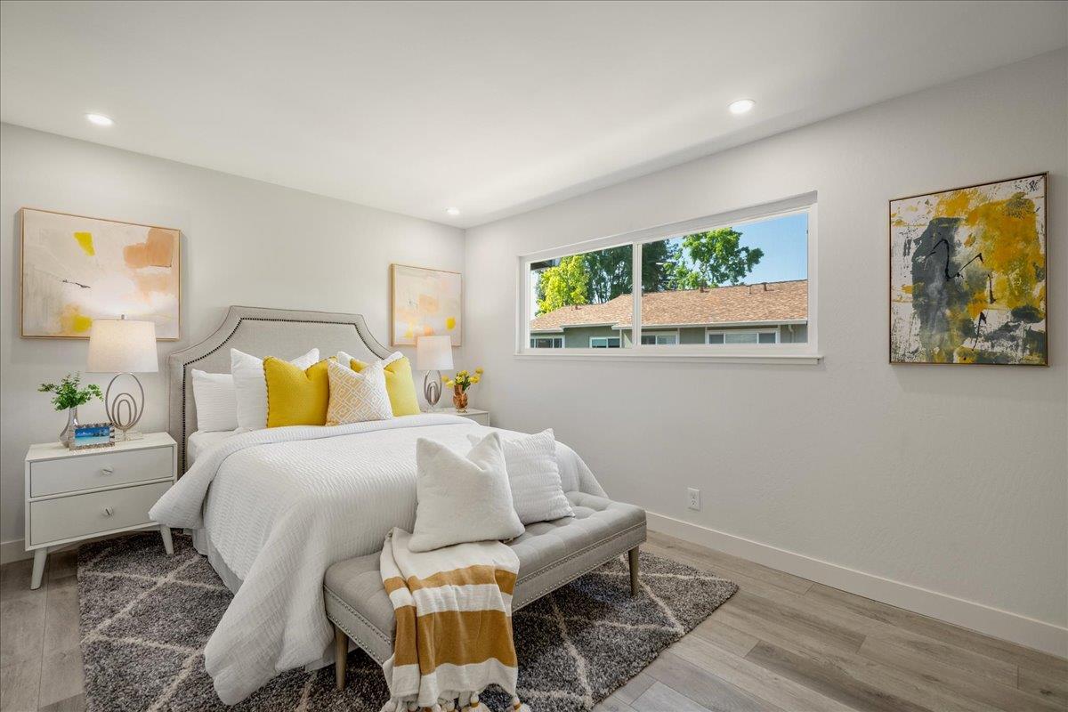 4790 Raspberry Place San Jose, CA 95129 - Photo 14 of 45 a bedroom with a bed and wooden floor