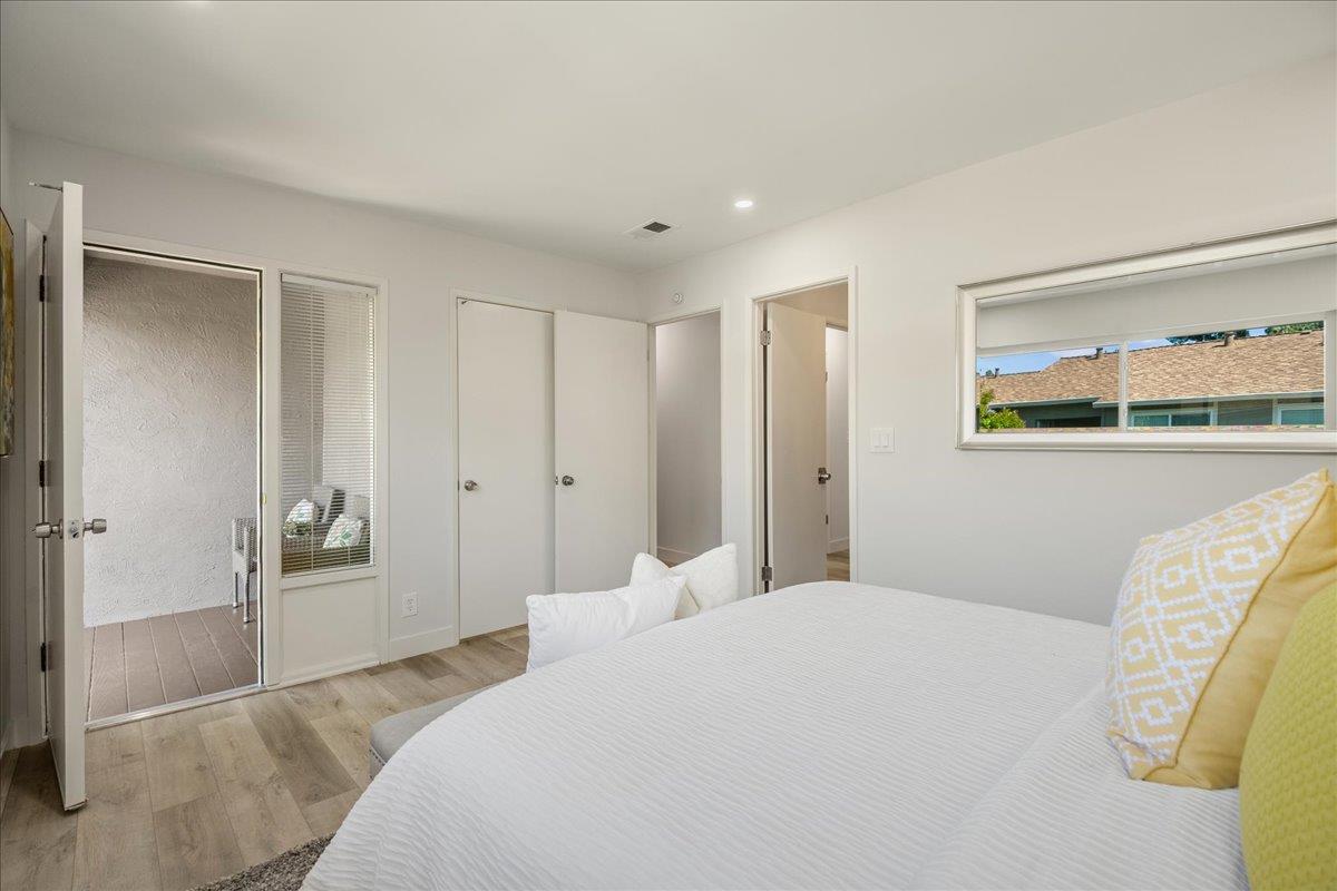 4790 Raspberry Place San Jose, CA 95129 - Photo 15 of 45 a bedroom with a bed and a painting on the wall