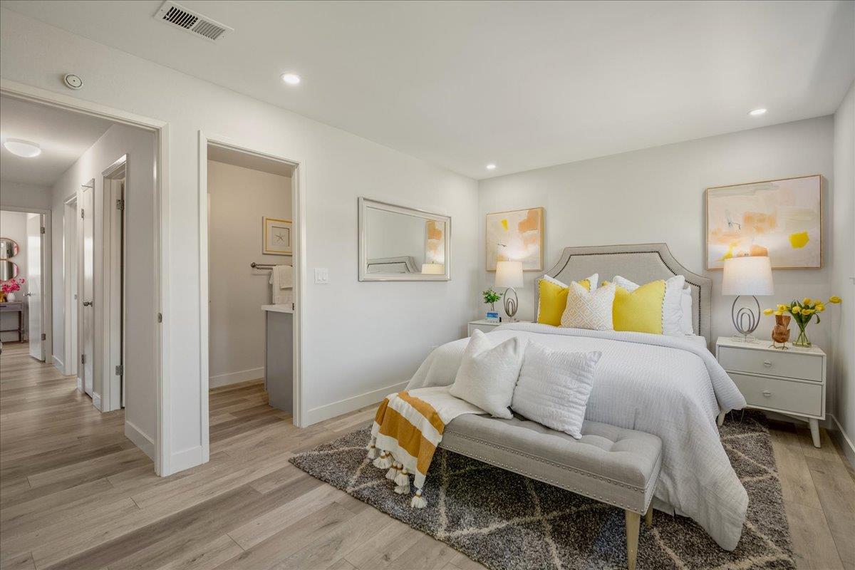 4790 Raspberry Place San Jose, CA 95129 - Photo 17 of 45 a bedroom with a bed and wooden floor