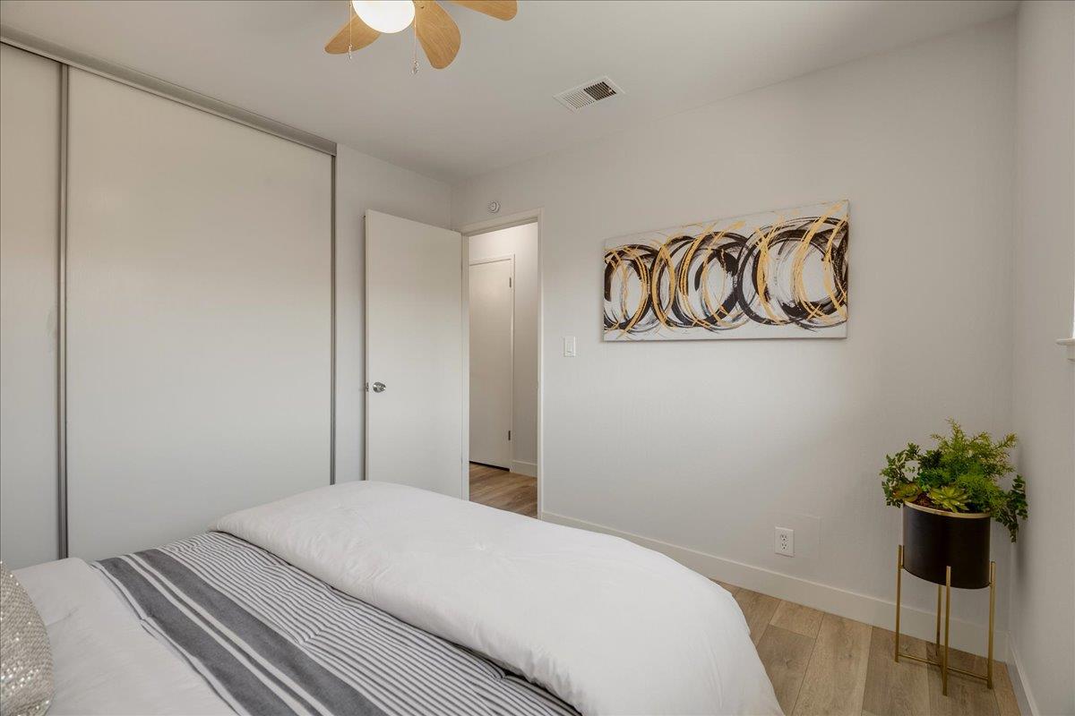4790 Raspberry Place San Jose, CA 95129 - Photo 21 of 45 a bedroom with a bed and a potted plant