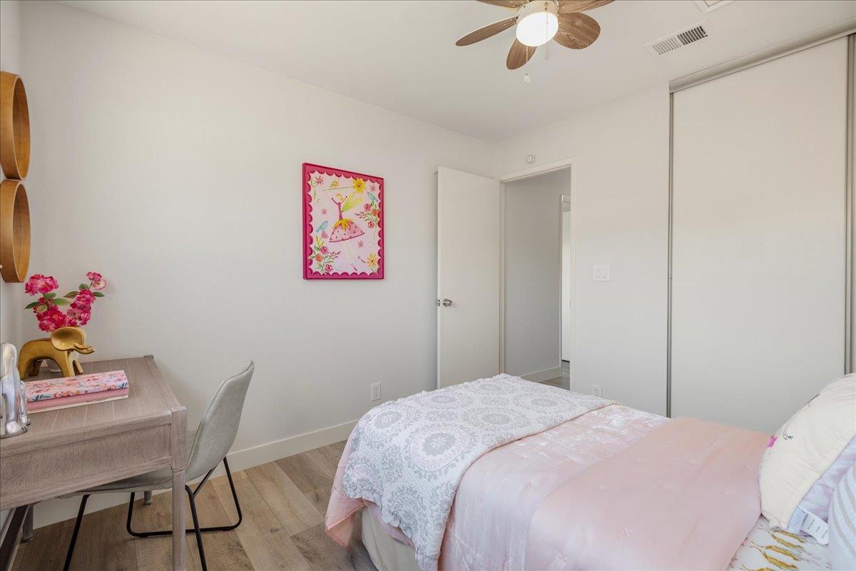 4790 Raspberry Place San Jose, CA 95129 - Photo 23 of 45 a bedroom with a bed and a chandelier