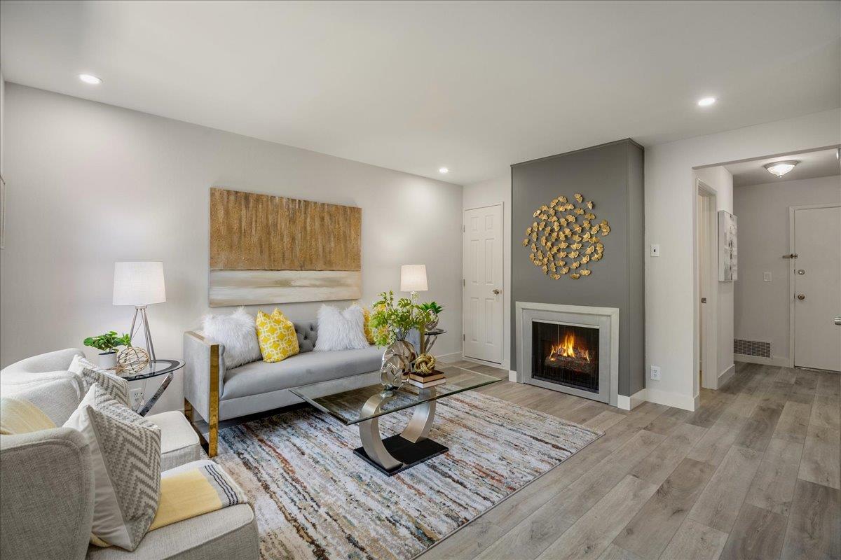 4790 Raspberry Place San Jose, CA 95129 - Photo 3 of 45 a living room with furniture and a fireplace