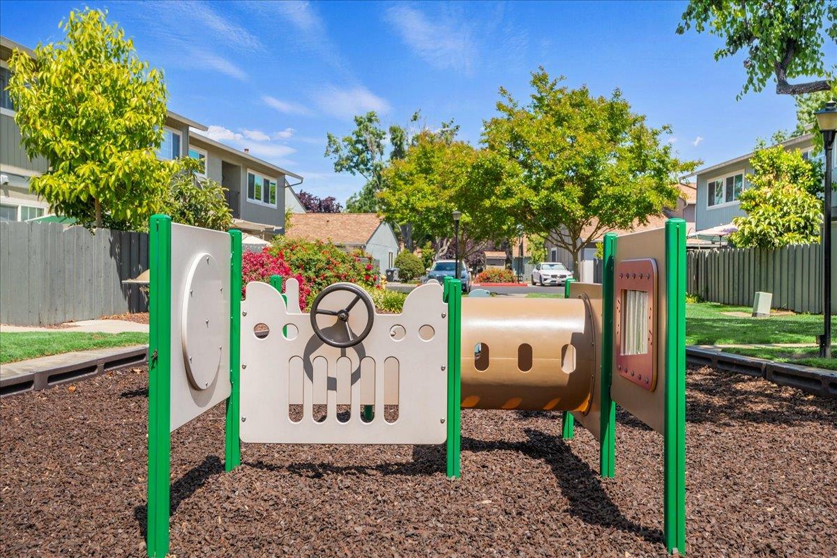 4790 Raspberry Place San Jose, CA 95129 - Photo 41 of 45 a view of a street with potted plants and a tree