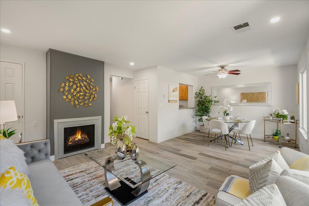 4790 Raspberry Place San Jose, CA 95129 - Photo 5 of 45 a living room with furniture and a fireplace