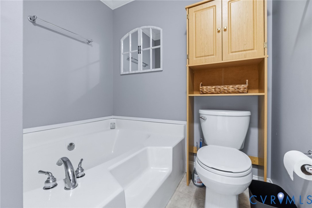 10910 Courthouse Road Dinwiddie, VA 23841 - Photo 25 of 38 Integrated soaking tub with chrome fixtures, wood-
