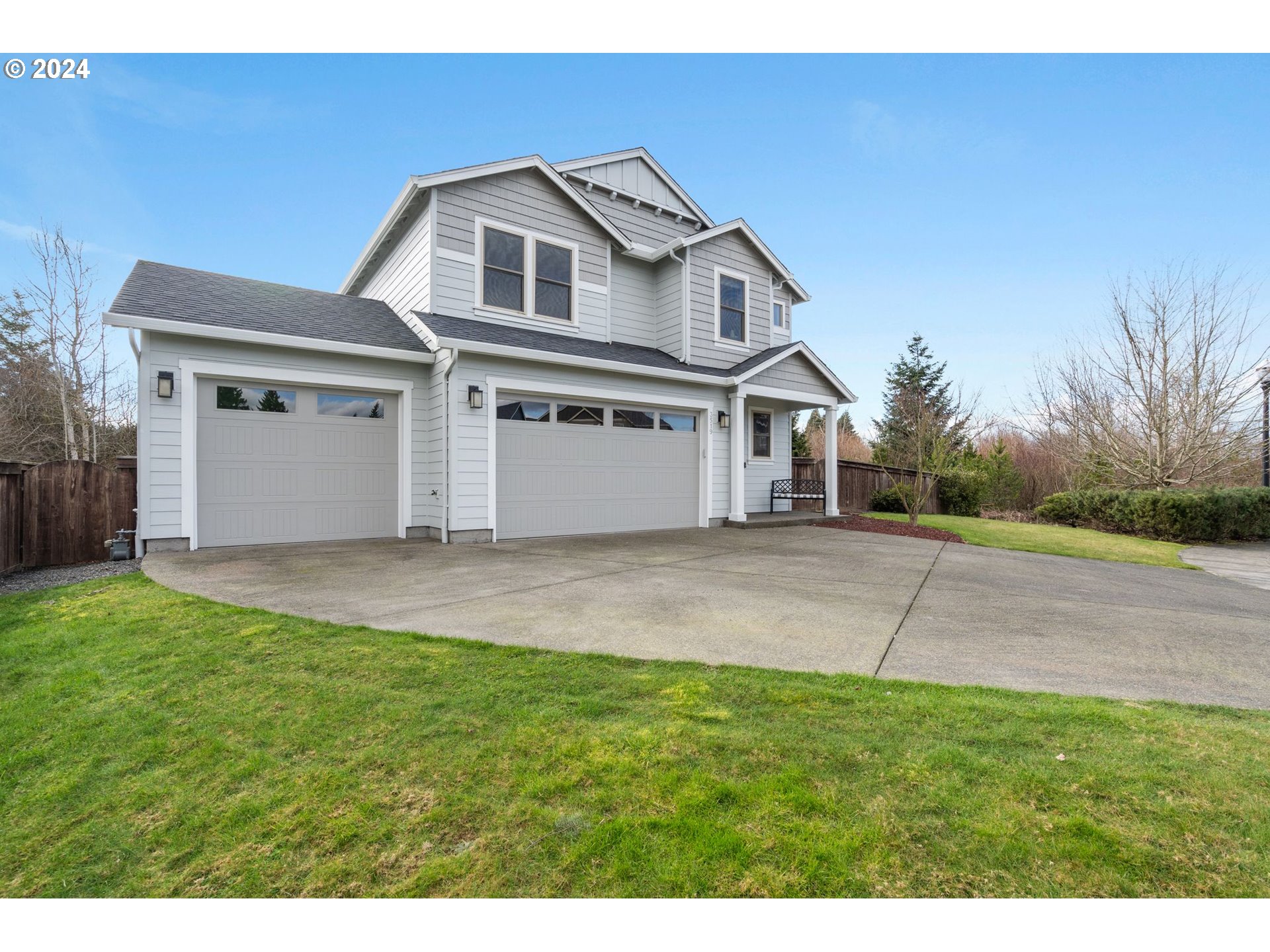 3519 North 6th Circle Ridgefield, WA 98642 - Photo 34 of 40 a front view of a house with a yard and garage